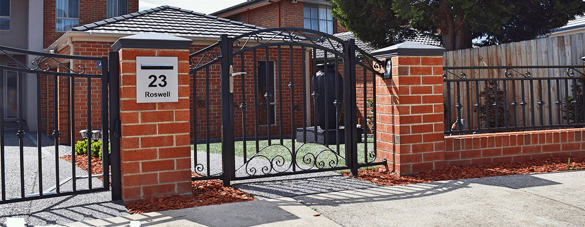 Custom Buitl Fences Steel and Brick Fence and gate