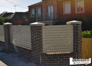 Custom built fences Aluminium infill and brick pillar fence