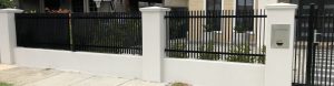 Rendered Pillars and steel infill fence designed and built by Custom Built Fences