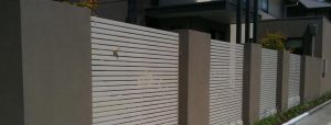 Rendered fence with Aluminium infills designed and built by Custom Built Fences