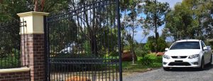 Brick Pillar Fence with large steel double gates designed and built by Custom Built Fences